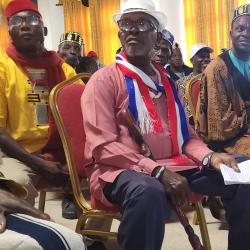 Suspended Paramount Chief Robert Sennah (center), Chairperson of the County Council of Chiefs of Nimba. 