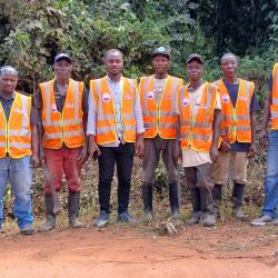 Photo credit: MIA Asst. Min. for Technical Services Orando F. Armah poses with the Road Inspection Delegation &amp; some other workers