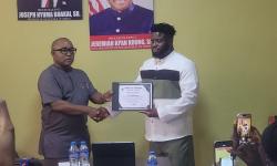 Hon. Sirleaf R. Tyler  Certificates Mr. Selikie Sesay as First Liberian to Drive from France to Liberia by Land.