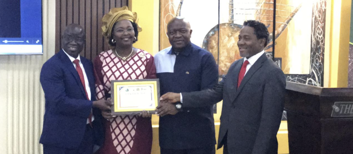  (IFAD) Country Representative Madam Pascaline Barankeba receiving a certificate of Appreciation from the government of Liberia