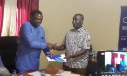 MSG Chair C. Mike Doryen (left) receives report from HoS Yates (right)